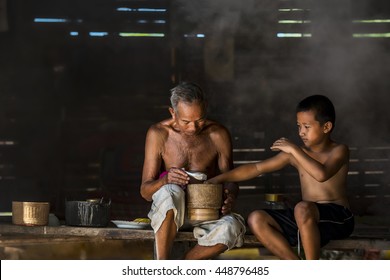 Grandfather And Grandson Eating At Country Home,countryside Asia,