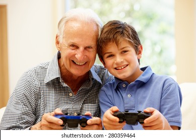 Grandfather And Grandson Playing Computer Games