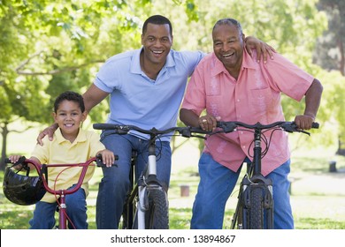 Grandfather Grandson And Son Bike Riding