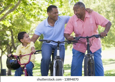 Grandfather Grandson And Son Bike Riding