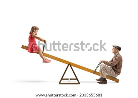 Grandfather playing on a seesaw with a little girl isolated on white background