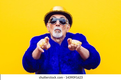 Grandfather portraits on colored backgrounds. Funny moments with senior old man