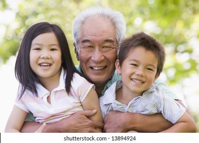 Grandfather posing with grandchildren