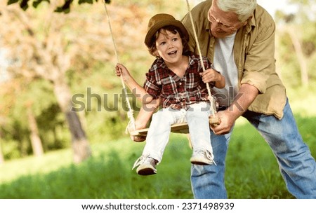 Similar – Image, Stock Photo Grandson on the swing (with a plaster on his knee)
