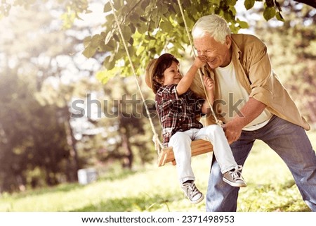 Similar – Image, Stock Photo Grandson on the swing (with a plaster on his knee)