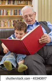 Grandfather Reading A Story To His Grandchild