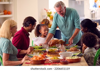 Grandfather Serving As Multi-Generation Family Celebrating Thanksgiving At Home Eating Meal Together - Shutterstock ID 2206651119