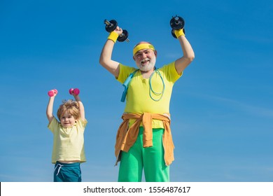 Grandfather And Son Doing Exercises. Father And Children Having Workout. Senior Man And Child In Family Health Club. Sports For Kids