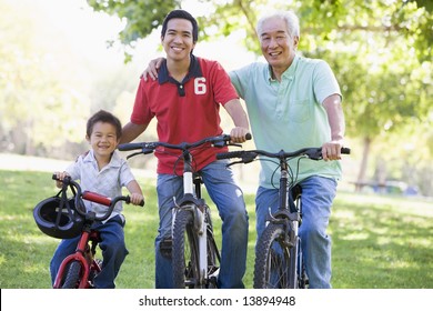 Grandfather Son And Grandson Bike Riding