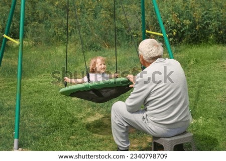 Similar – junge wirft einen Ball auf die Oma