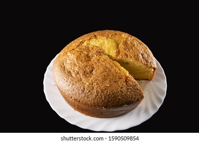 Grandma Cake Sliced, In A Wavy White Plate, On A Black Background