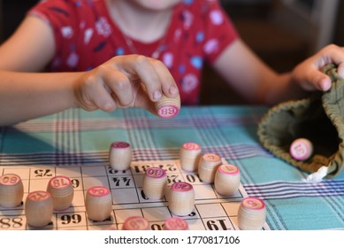 Grandma and granddaughter play Lotto.