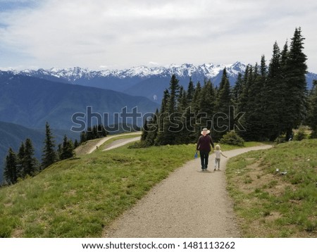 grandma and granddaughter walking the trail at house ridge