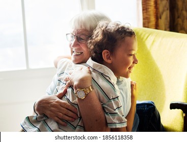 Grandma And Grandson Hugging After Social Distancing