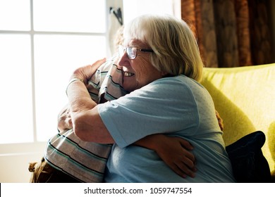 Grandma and grandson hugging together - Shutterstock ID 1059747554