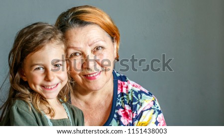 Similar – Granddaughter hugging her grandmother