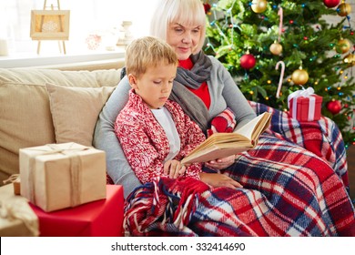 Grandma Reading Christmas Story To Her Grandson