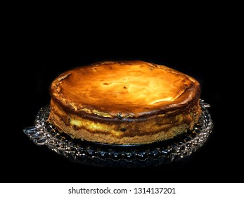 Grandma S Cheesecake, Freshly Baked On A Glass Plate, Black Background.