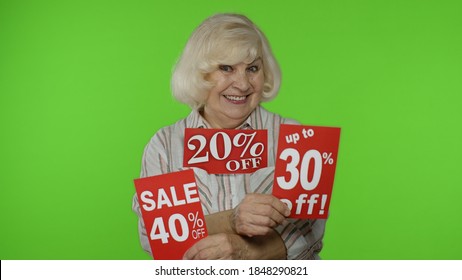 Grandma Showing Sale Percent Discounts Advertisement Inscriptions Banners. Grandmother Rejoicing Good Discounts, Low Prices For Online Shopping Sales. Black Friday Concept. Chroma Key