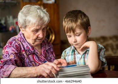 Grandma shows grandson photo album.