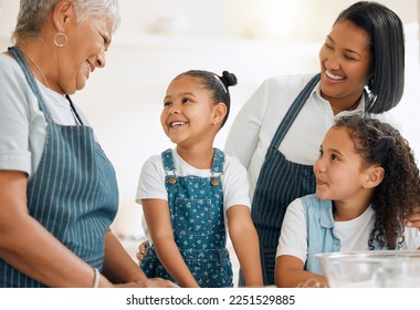 Grandma is teaching us her special recipe. Shot of a multi-generational family baking together at home. - Powered by Shutterstock