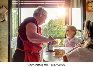 Grandma With Two Nephew Cooking Pasta. Old And New Generation. Traditional Value Passed From Generation To Generation. Family Concept , Human Value. Slow Motion 