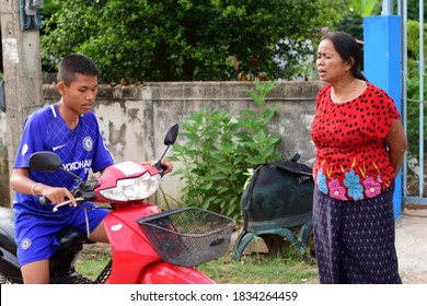 Grandma Is Warning Her Grandson Who Is Going To Drive A Motorbike That Not  Drive Too Fast To Prevent An Accident And He Seemed To Have Heeded That Warning. Khonkaen Thailand,15 October 2020