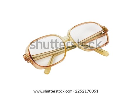 Grandma's glasses on a white background. Old fashioned glasses isolated on white background. Grandpa's old glasses.