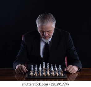 Grandmaster In A Suit Playing Chess