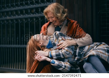 Similar – Image, Stock Photo happy twin sisters stand on a bridge and look up