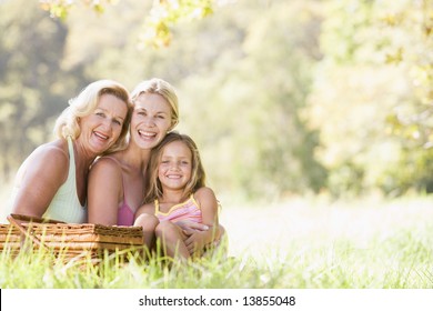 Grandmother with adult daughter and grandchild on picnic - Powered by Shutterstock