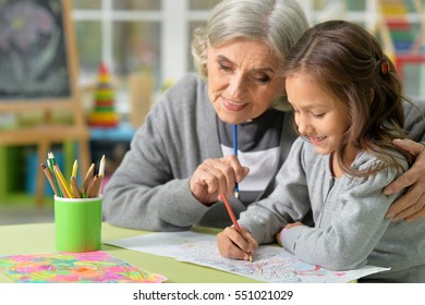 Grandmother And Child Drawing