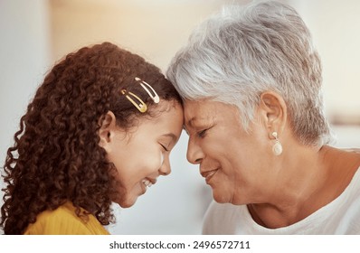 Grandmother, child and forehead touch for love in home, affection and bonding or care in living room. Family, grandchild and grandma on couch and happy on weekend, comfort and smile in house lounge - Powered by Shutterstock