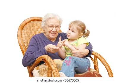 Grandmother And The Grand Daughter In An Armchair