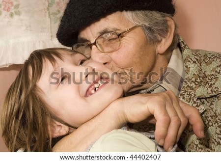 Image, Stock Photo Grandma cuddles up with her grandson