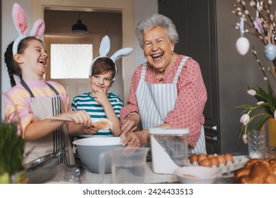 Grandmother with grandchildren preparing traditional easter meals, baking cakes and sweets. Passing down family recipes, custom and stories. - Powered by Shutterstock