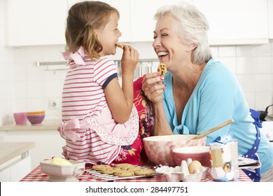 Grandmother And Granddaughter Baking In Kitchen - Powered by Shutterstock