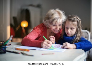 Grandmother and granddaughter drawing
