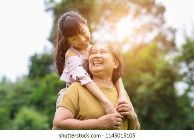 Grandmother and granddaughter enjoyed in the garden.Asian family conception