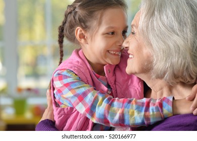 Grandmother And Granddaughter Hug