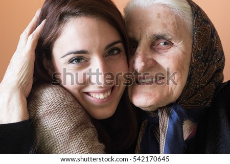 Similar – Female caretaker posing with elderly patient