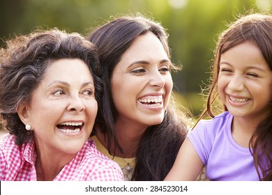 Grandmother With Granddaughter And Mother In Park
