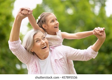Grandmother with granddaughter  in park