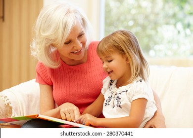 Grandmother And Granddaughter Reading