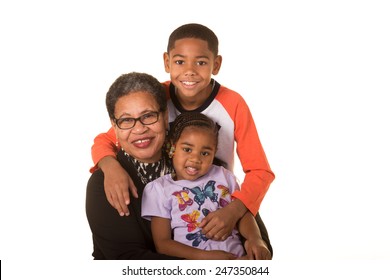 A grandmother and her grandchildren isolated on white