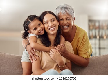 Grandmother, mom and child hug in a portrait for mothers day on a house sofa as a happy family in Colombia. Smile, mama and elderly woman love hugging young girl or kid and enjoying quality time - Shutterstock ID 2216278703