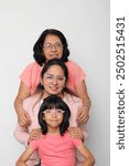 Grandmother, mom and daughter, three generations of dark-skinned Latina women show the importance of ancestors and female lineage on Mother