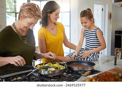 Grandmother, mother and child with happy cooking together for teaching, learning and bonding in home. Food, women and girl in kitchen for lunch with fun, love and sharing healthy recipe on counter - Powered by Shutterstock