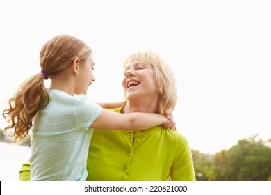 Grandmother Playing With Granddaughter Outdoors - Powered by Shutterstock