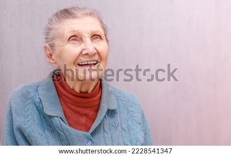 Grandmother portrait 90 years old, longevity, aging woman smiles beautifully, elderly life, longevity, anti-aging, elderly grandmother with gray hair.
